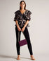 JASMYNA-Tops-Ruffled to perfection and finished with a bow, JASMYNA is your ticket to style heaven. Bottomless brunch? More like your own personal catwalk.The fabric of this product is made of 100% recycled polyester. Using recycled polyester helps divert plastic waste from ending in landfills and helps us to reduce our dependancy on virgin materials. Ruffled top V-neck Abstract print Short sleeved Low back with tie fastening and zip Amy is 5'9.5" / 1.77m and wears Black in a Ted size 1- Ted Baker Romania